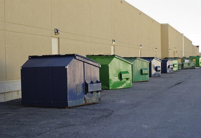 metal waste containers sit at a busy construction site in Bradford